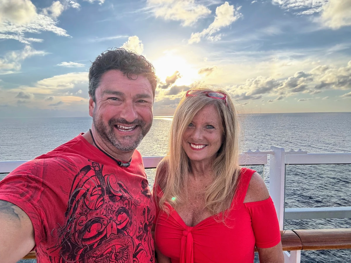 Ugo and Kellie together by the water at sunset